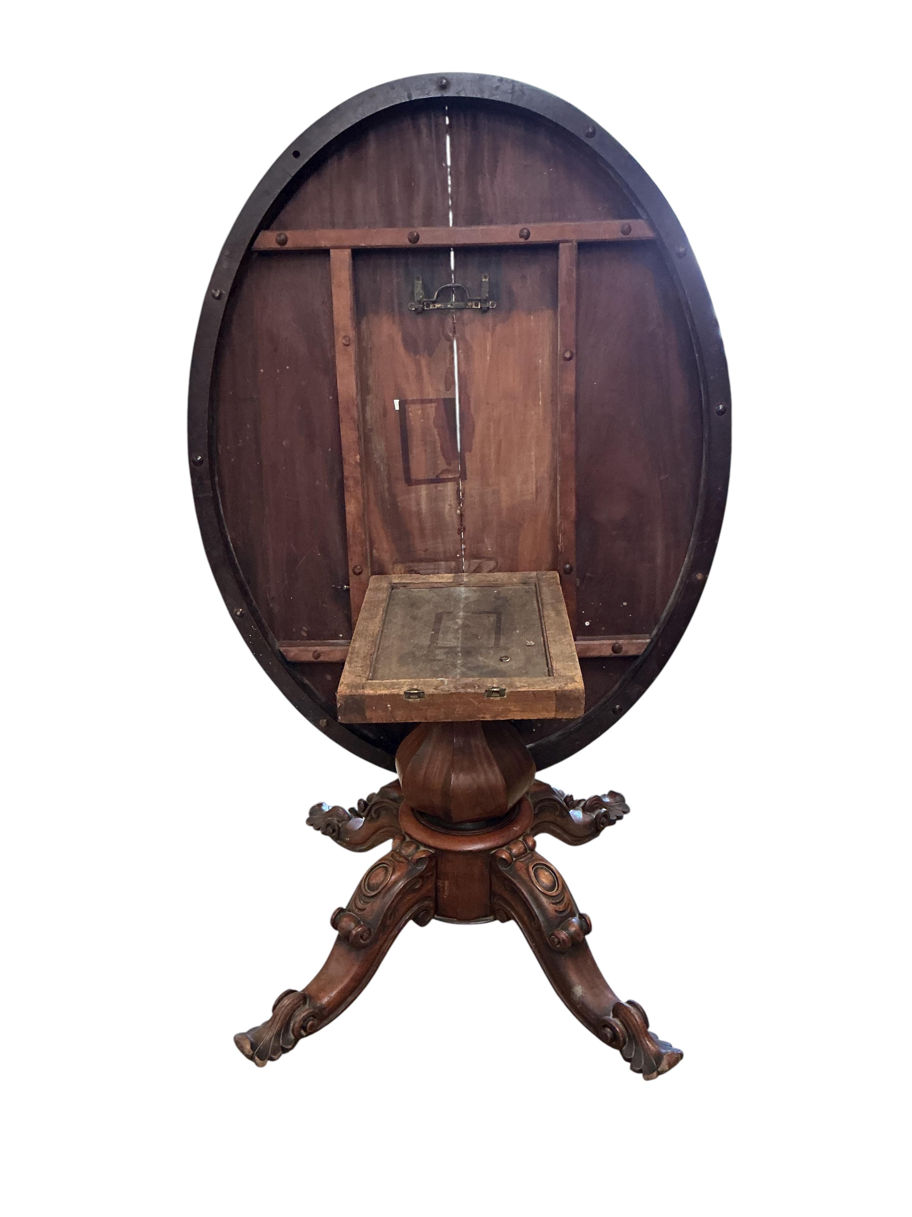 An early Victorian oval mahogany tilt top loo table, width 108cm, depth 140cm, height 71cm